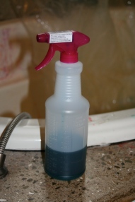 spray bottle of dye mix